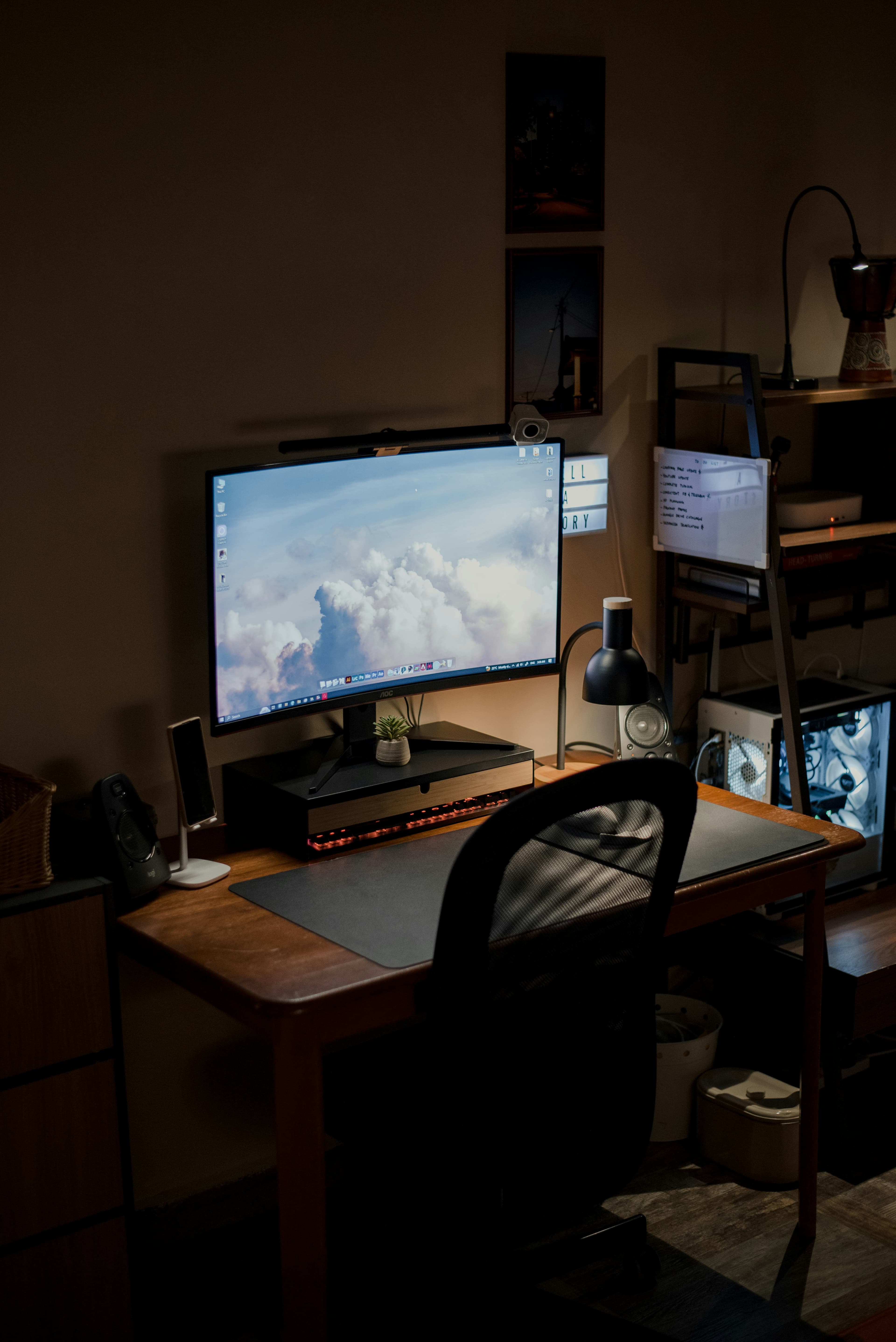 A young professional focused on her laptop in a modern home office